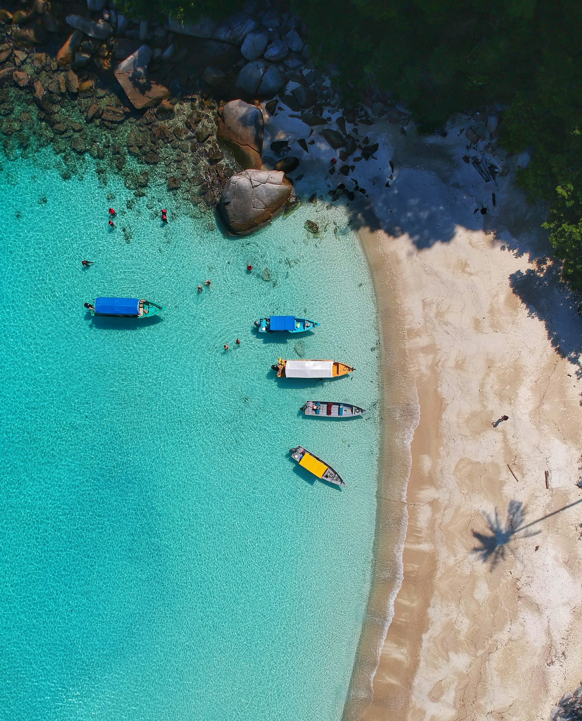 Aerial view of turquoise lagoon and white-sand beach on Samal Island